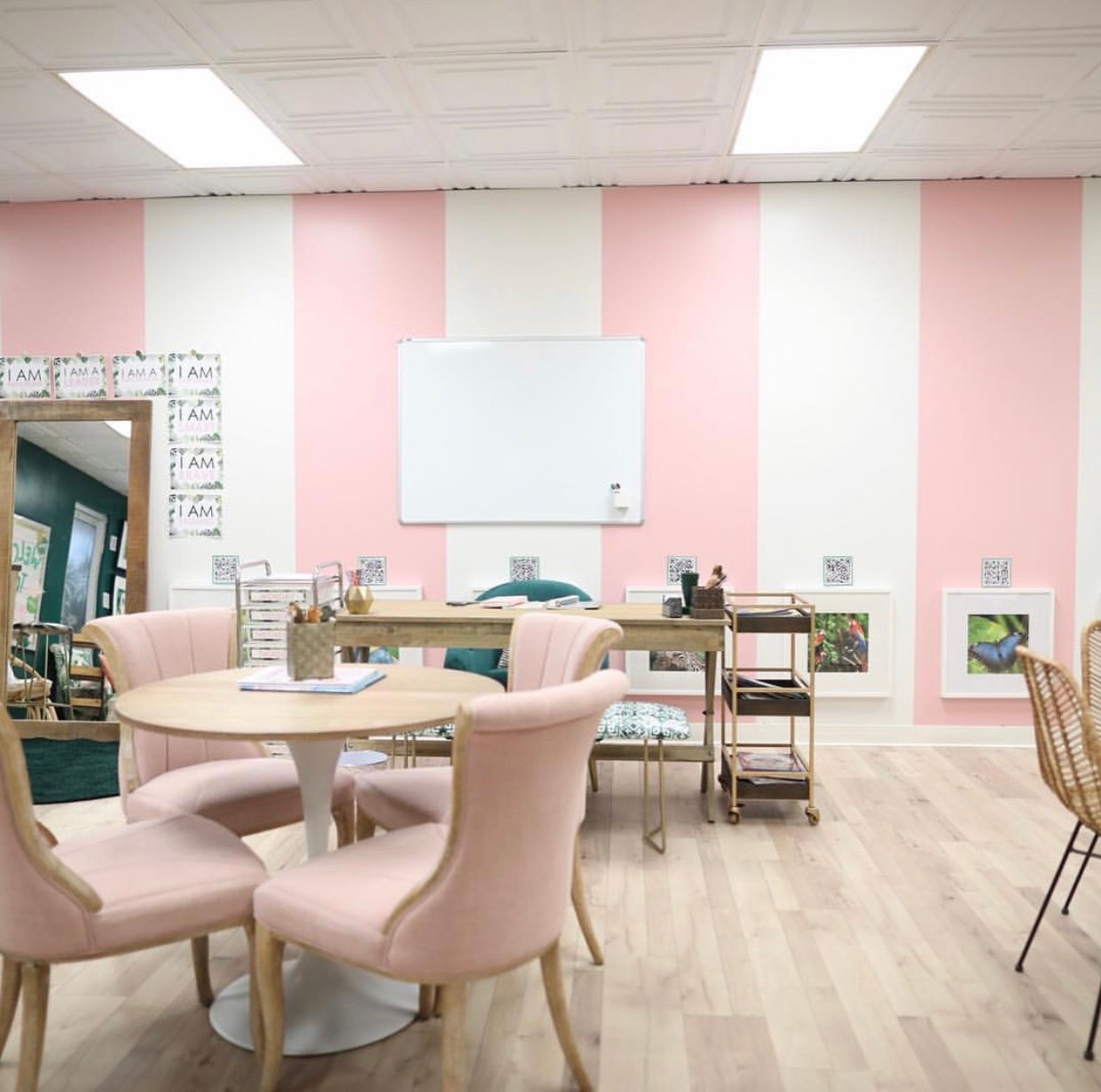 classroom with pink and white stripes on walls
