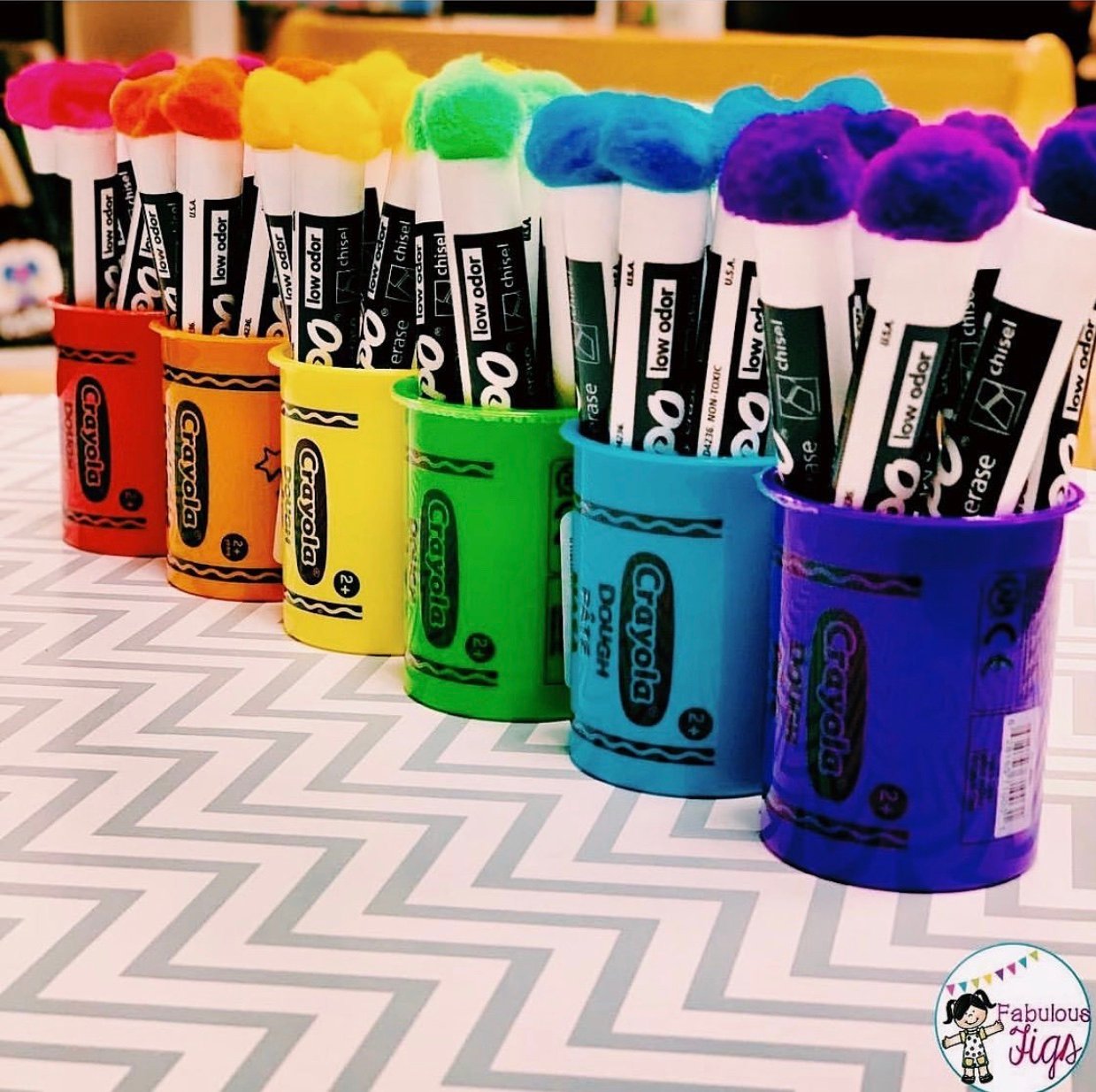 marker organization in Play-Doh containers for classroom