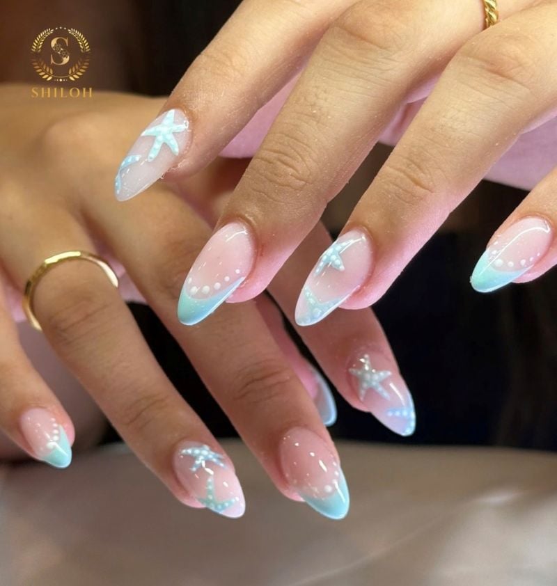 light blue starfish nail design