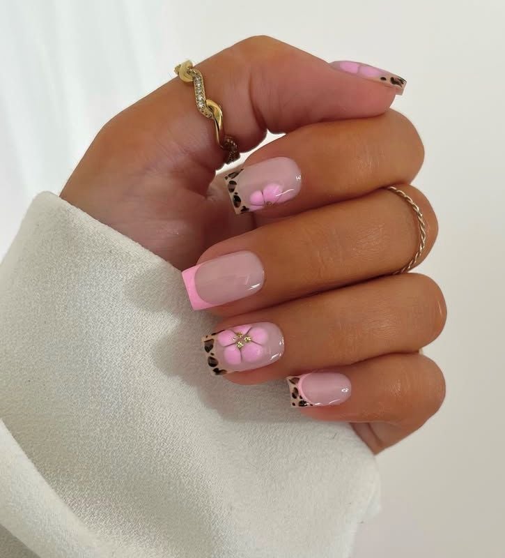 pink leopard print nail design with flower